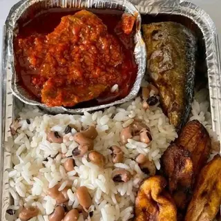 White rice mixed with beans, beef, tilapia fish and plantains 