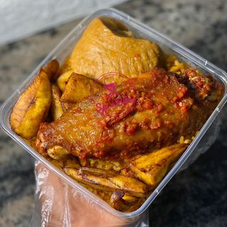 Jollof rice , moimoi and peppered turkey 