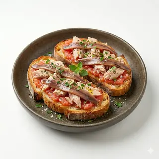 Tosta tomate, atun y anchoa