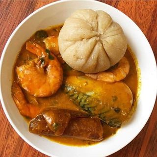 White Eba served with titus fish mixed with pomo and ogbono 