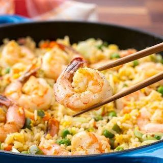 Fried rice stirred with fresh vegetables and shrimps