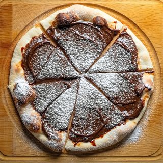 Pizza Nutella con zucchero a velo