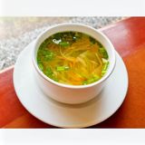 Clear Vegetable Soup Served With House Bread