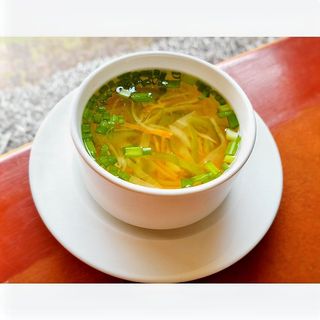 Clear Vegetable Soup Served With House Bread