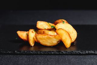 Картопляні дольки з часником (150г)