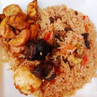 Goat meat jollof rice +2beef +egg +plantain 