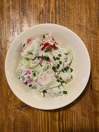 Cucumbers with tomatoes and sour cream