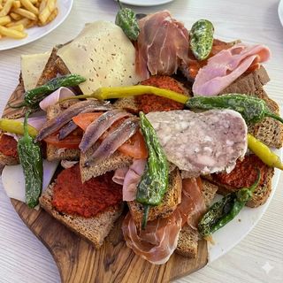 2 Rebanadas De Anchoas Y Queso