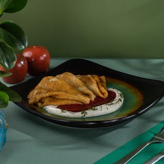 Coconut blinchiki with berry mix