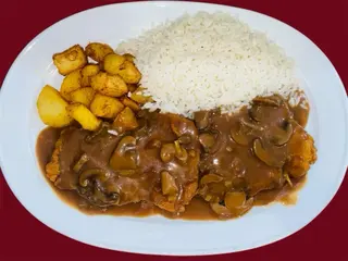 Escalope de cerdo con salsa