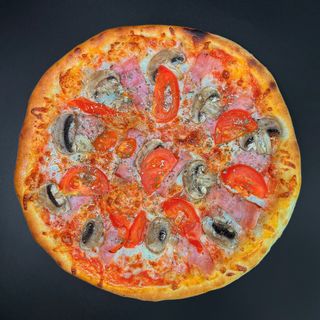 Піца з шинкою та грибами