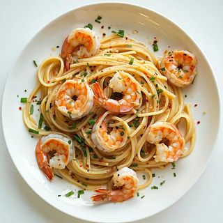 34. Spaghetti saltati con gamberi