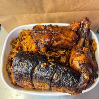 Asun jollof rice with chicken and fish