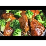 Whole fish plays with broccoli