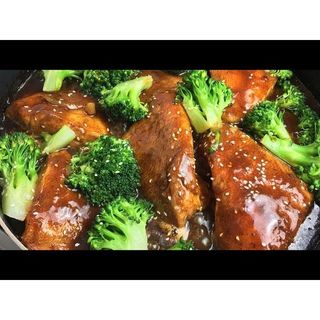 Whole fish plays with broccoli