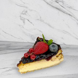Ración cheesecake de frutos rojos