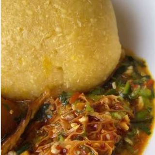 Yellow Eba served with okro mixed with shaki