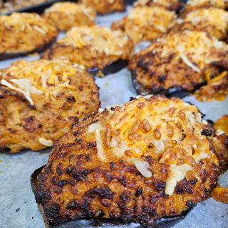 Ración De Berenjena Rellena De Carne