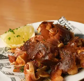 Oreja adobada a la palncha