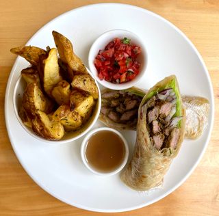 Beef Chapati Rolls with rosemary roasted potato wedges , Kachumbari