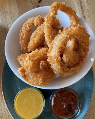 7 Aros De Cebolla Rebozados (Ración)