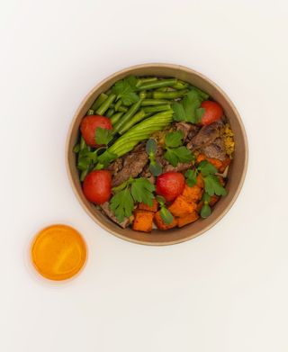 Bowl with beef tenderloin, sweet potato and red lentils