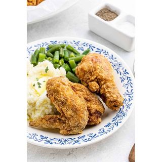 Fried chicken with potatoes and green papers