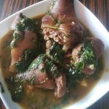 Swallow with vegetable and Goat meat pepper soup