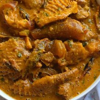 Ogbono mixed with shaki, pomo and chicken