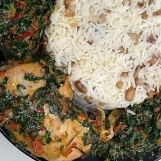 Whiterice mixed with oloyin beans served with efo in assorted beef and chicken