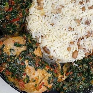 Whiterice mixed with oloyin beans served with efo in assorted beef and chicken
