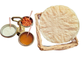 Two papadum with dips
