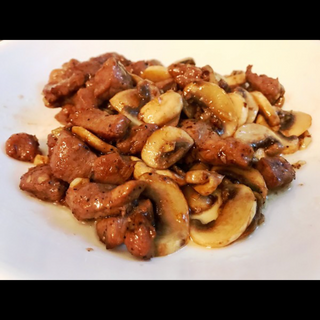 ternera con champiñones