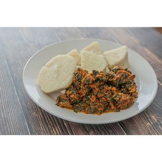 Efo riro and Poundo yam with meat and Kpomo