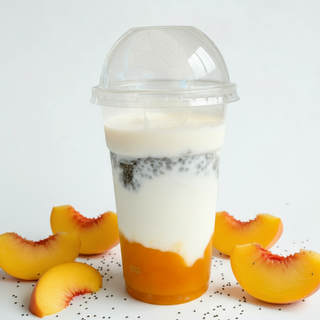 Yogur con topping de melocotón. 