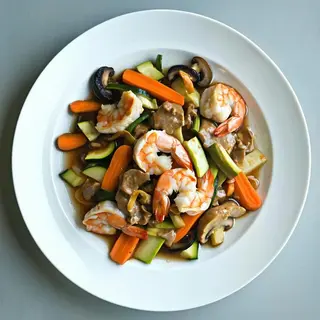 Pollo con gamberi e carne