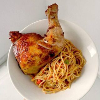 Nigerian Jollof Sphaghetti served with chicken 