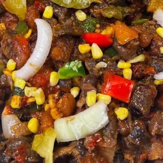 Gizdodo plain. Cubed plantains mixed with peppered Gizzards in sweet corns 