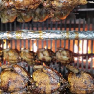 Mezzo pollo allo spiedo a legna