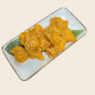 Цыпленок в кляре и в соусе спайси (200г)