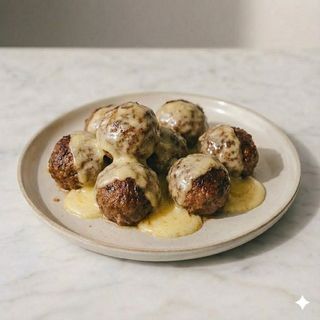 Polpette di black angus con fonduta di parmigiano