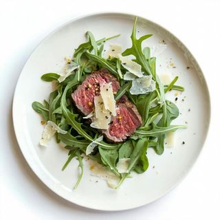 Filetto di manzo con rucola e grana