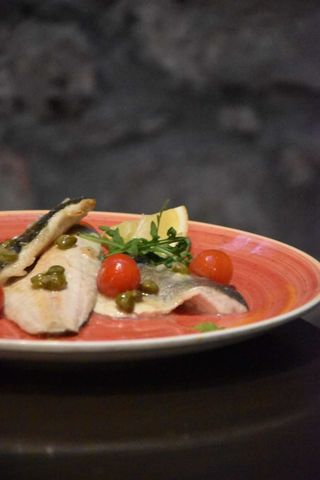 Sea bass fillets in istrian malvasia wine sauce with cherry tomatoes