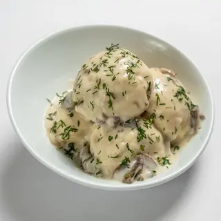 Галушки з м'ясом під грибним соусом( 300/200г)