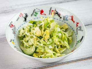 Салат з молодої капусти з огірком та олією (125g)