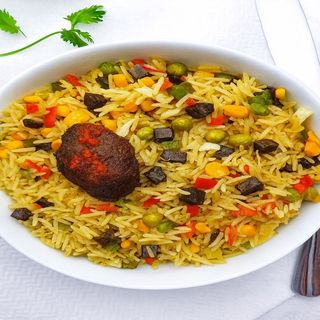 Fried rice, plantain and  beef