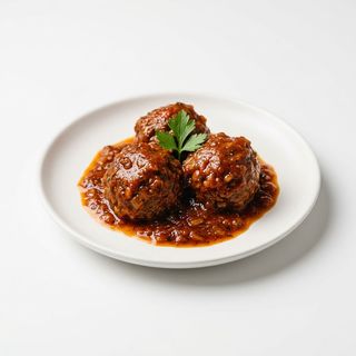 1/2 Ración De Albóndigas En Salsa