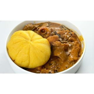 Ogbono soup and eba with meat and Kpomo