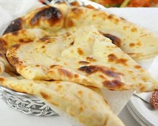 Stuffed naan aloo paratha with raita
