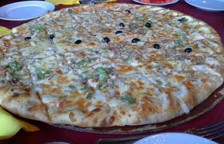 Pizza méga fromage salade